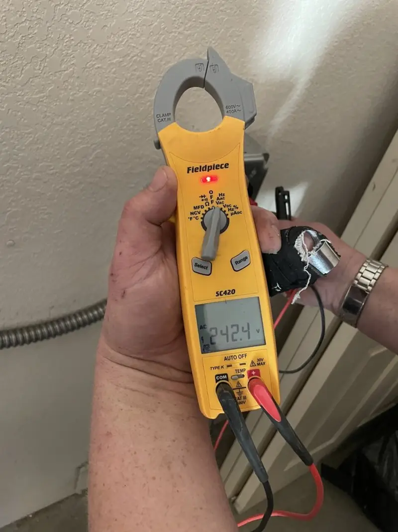 Voltage testing with clamp meter during Generator Installation in Greeley